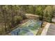Aerial view of the basketball court surrounded by trees and parking, perfect for recreation and outdoor enjoyment at 174 Vandiver Ct, Acworth, GA 30101