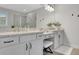 Bathroom features double vanity with granite counters, white cabinets, and a large mirror at 174 Vandiver Ct, Acworth, GA 30101