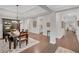 Spacious dining room with dark wood floors, coffered ceiling and open floor plan at 174 Vandiver Ct, Acworth, GA 30101
