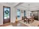 Elegant dining room featuring hardwood floors, coffered ceilings and modern light fixture at 174 Vandiver Ct, Acworth, GA 30101