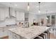 Open kitchen features a large island with seating, pendant lighting, and modern appliances at 174 Vandiver Ct, Acworth, GA 30101