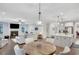 Living room features a fireplace, hardwood floors, and is open to the modern kitchen and breakfast nook, perfect for entertaining at 174 Vandiver Ct, Acworth, GA 30101
