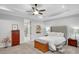 Main bedroom boasts neutral paint, carpeted floors, white bedding, and a gray upholstered headboard at 174 Vandiver Ct, Acworth, GA 30101