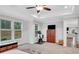 Spacious main bedroom with lots of light, neutral paint, and an exercise bike at 174 Vandiver Ct, Acworth, GA 30101