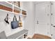 Organized mudroom with built-in bench, cubbies, and hooks, providing a practical and stylish entry point to the home at 174 Vandiver Ct, Acworth, GA 30101