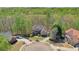 Aerial view showcasing the property, surrounding neighborhood and cul-de-sac street at 205 Northampton Ct, Canton, GA 30115