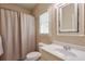 Neutral bathroom featuring a white vanity, framed mirror, and a shower with a neutral curtain at 205 Northampton Ct, Canton, GA 30115