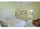 Bedroom with yellow walls, closet, and view of the bathroom at 205 Northampton Ct, Canton, GA 30115