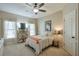 Bedroom with white bedding, two windows with sheer curtains, and overhead lighting at 205 Northampton Ct, Canton, GA 30115