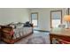 Cozy bedroom with a daybed, two windows, and natural light at 205 Northampton Ct, Canton, GA 30115