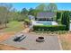 Community amenities with a pool, fire pit, picnic table, and landscaping at 205 Northampton Ct, Canton, GA 30115
