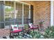 Charming front porch with rocking chairs, decorative pillows, and potted plants, perfect for relaxing outdoors at 205 Northampton Ct, Canton, GA 30115