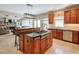 Spacious kitchen with center island offers seamless connectivity to the living space, ideal for entertaining at 205 Northampton Ct, Canton, GA 30115