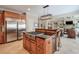 This kitchen has a large island, stainless appliances, and a seamless transition to the living room at 205 Northampton Ct, Canton, GA 30115