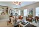A cozy living room with built-in shelving, a ceiling fan and a comfortable seating area at 205 Northampton Ct, Canton, GA 30115