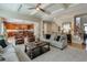 A bright living room showcases elegant coffered ceilings and seamlessly flows into the kitchen area at 205 Northampton Ct, Canton, GA 30115