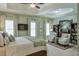 Spacious main bedroom with a tray ceiling, a sitting area, and ample natural light at 205 Northampton Ct, Canton, GA 30115