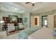This main bedroom features a tray ceiling, sitting area, and ensuite bathroom access at 205 Northampton Ct, Canton, GA 30115