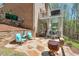 Multi-level patio with comfortable seating, a fire pit and scenic views in the back yard at 205 Northampton Ct, Canton, GA 30115
