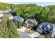 Aerial view of the home showing its manicured lawn, landscaping, and neighborhood at 1207 Promontory Path, Marietta, GA 30062