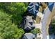 Aerial view of the house with mature trees, manicured landscaping and neighborhood layout at 1207 Promontory Path, Marietta, GA 30062
