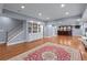 Finished basement area with hardwood floors, a wet bar, and a staircase at 1207 Promontory Path, Marietta, GA 30062