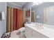 Neutral toned bathroom with a shower and a white vanity with a large mirror above at 1207 Promontory Path, Marietta, GA 30062