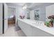 Bright bathroom features a large vanity, dual sinks, and tile floors at 1207 Promontory Path, Marietta, GA 30062