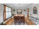 Formal dining room with wood table, seating for six and decorative chandelier at 1207 Promontory Path, Marietta, GA 30062