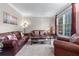 Inviting living room with comfortable seating, soft carpet, and ample natural light at 1207 Promontory Path, Marietta, GA 30062