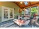 Cozy screened porch with wood ceiling, comfortable seating, and natural light at 1207 Promontory Path, Marietta, GA 30062