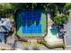 Aerial view of well-maintained tennis courts and a pool, surrounded by lush landscaping and mature trees at 1207 Promontory Path, Marietta, GA 30062