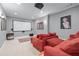 Home theater room features a large screen, comfortable red seating, and recessed lighting at 1207 Promontory Path, Marietta, GA 30062