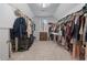 Large walk-in closet with ample storage space, including shelving and hanging racks at 1207 Promontory Path, Marietta, GA 30062