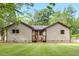 Green backyard with spacious lawn and patio area, perfect for outdoor gatherings at 2831 Ivanhoe Se Ln, Smyrna, GA 30082