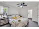 Bright bedroom features a modern ceiling fan, neutral paint, new carpet and ample natural light for a cozy retreat at 2831 Ivanhoe Se Ln, Smyrna, GA 30082