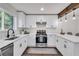 Modern updated kitchen featuring new stainless appliances, white cabinets, and abundant natural light from a well-placed window at 2831 Ivanhoe Se Ln, Smyrna, GA 30082
