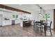 Modern kitchen with an island and new stainless appliances adjacent to dining area with stylish light fixtures at 2831 Ivanhoe Se Ln, Smyrna, GA 30082