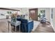 Spacious living area open to dining & kitchen with updated floors, beam, contemporary lighting, and on-trend wall decor at 2831 Ivanhoe Se Ln, Smyrna, GA 30082