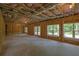 Unfinished basement framed and ready, with windows and doors offering lots of light and walkout to backyard at 380 Hillcrest View Dr, Suwanee, GA 30024