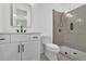 Bathroom featuring a walk-in shower, modern vanity with black hardware, and tiled floors at 380 Hillcrest View Dr, Suwanee, GA 30024