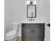 Well-lit half bath with a modern vanity, stylish mirror, and updated fixtures at 380 Hillcrest View Dr, Suwanee, GA 30024