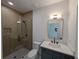 Modern bathroom with glass enclosed shower, sleek vanity, and stylish mirror, bright modern design at 380 Hillcrest View Dr, Suwanee, GA 30024