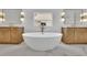 Gorgeous bathroom features a soaking tub, double vanity and decorative lighting at 380 Hillcrest View Dr, Suwanee, GA 30024