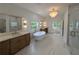 Spacious primary bath with double vanity, soaking tub, and separate glass shower at 380 Hillcrest View Dr, Suwanee, GA 30024