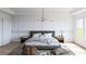 Bright and airy bedroom with modern lighting, neutral tones, and stylish décor at 380 Hillcrest View Dr, Suwanee, GA 30024
