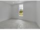 Bedroom with neutral walls and carpeting features a bright window view at 380 Hillcrest View Dr, Suwanee, GA 30024