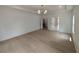 Open floor plan reveals a bedroom with wood floors connecting to a bathroom with a glass shower at 380 Hillcrest View Dr, Suwanee, GA 30024