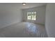 Clean bedroom showing protective plastic on the carpet at 380 Hillcrest View Dr, Suwanee, GA 30024