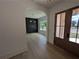 Inviting entryway with hardwood floors and archway to the dining area at 380 Hillcrest View Dr, Suwanee, GA 30024